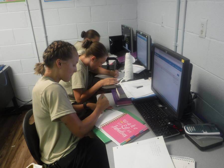 Female cadets participating in class