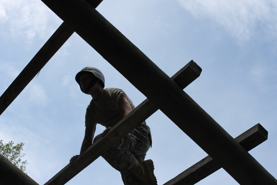 Cadet atop an obstacle