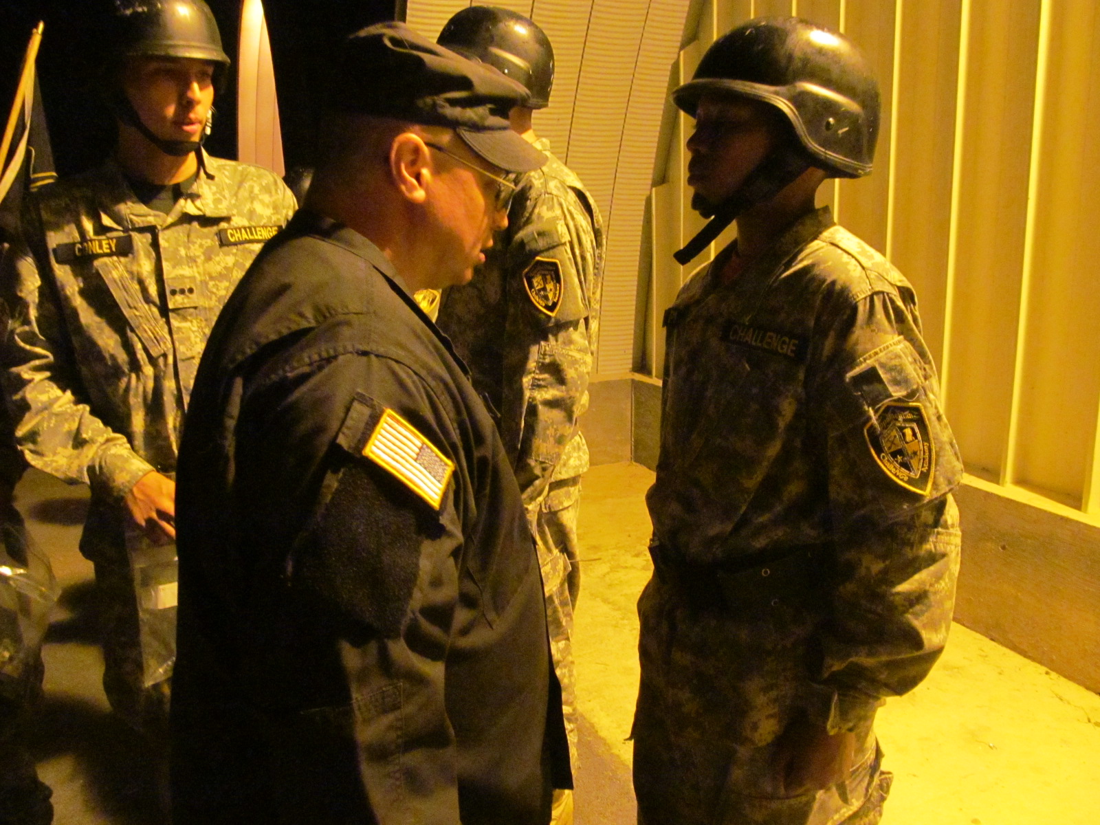 Cadet uniform being inspected by staff.